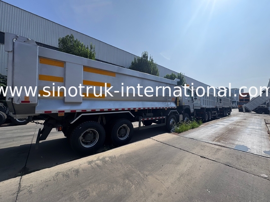 SINOTRUK HOWO 371HP 8X4 ট্যাপার ডাম্প ট্রাক নির্মাণ পুরানো সামনের মুখ সামরিক বাম্পার জন্য খনির এলাকায় দুটি সতর্কতা লাইট ইউ টাইপ কনটেইনার